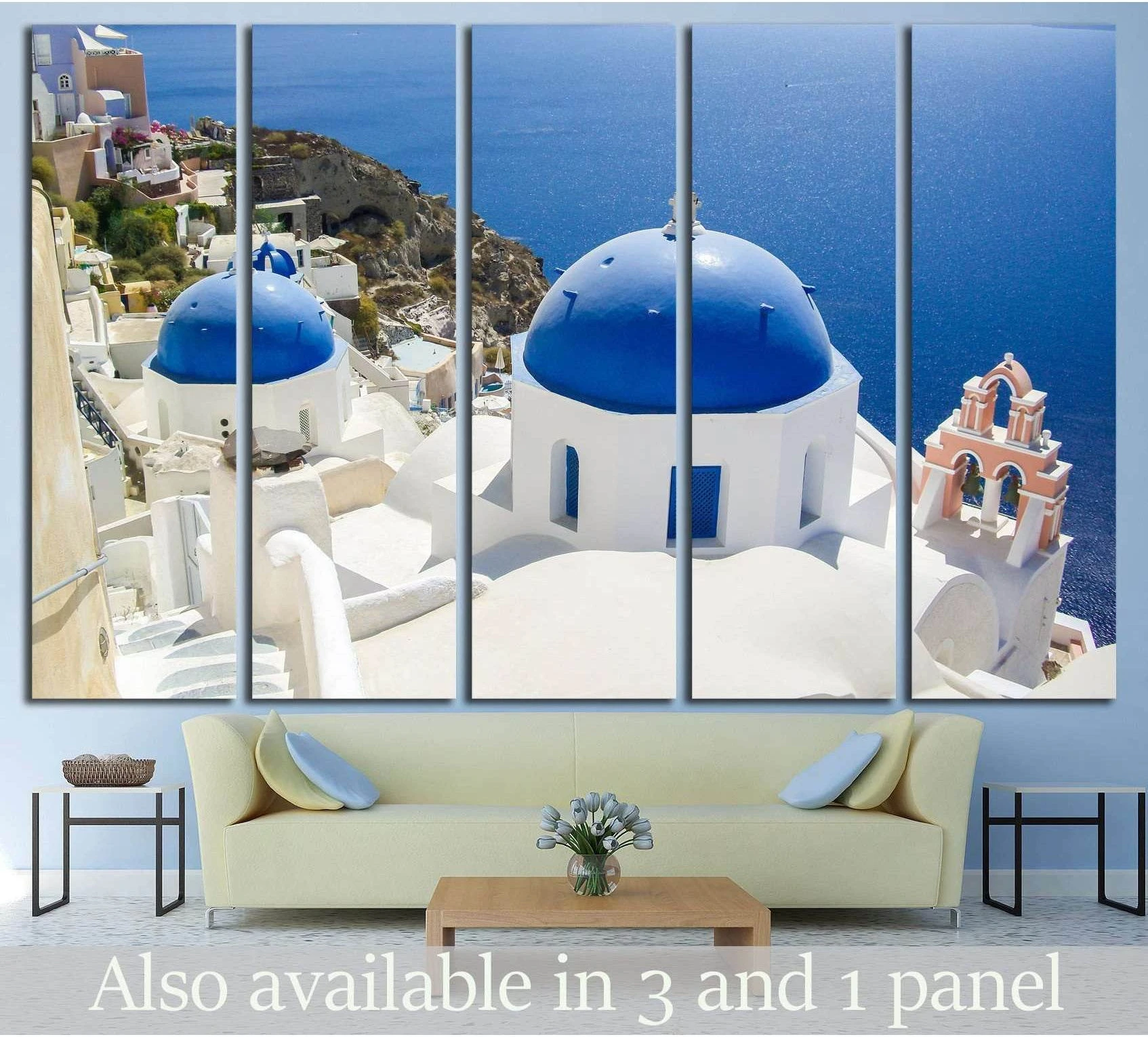 Santorini Oia canvas print with blue domes, white buildings, and Aegean sea view above sofa