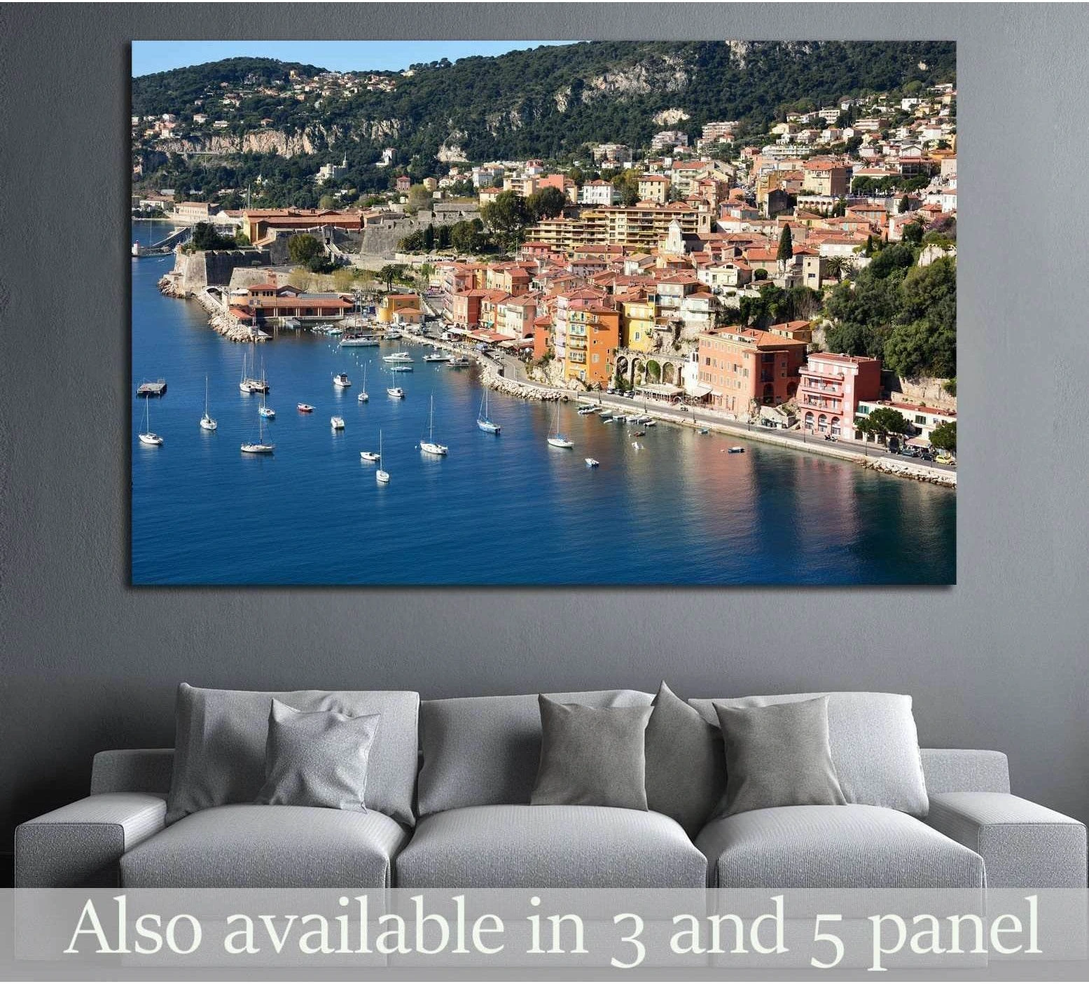 Villefranche-sur-Mer harbor canvas print with blue bay, sailboats, and colorful French Riviera waterfront above a gray sofa