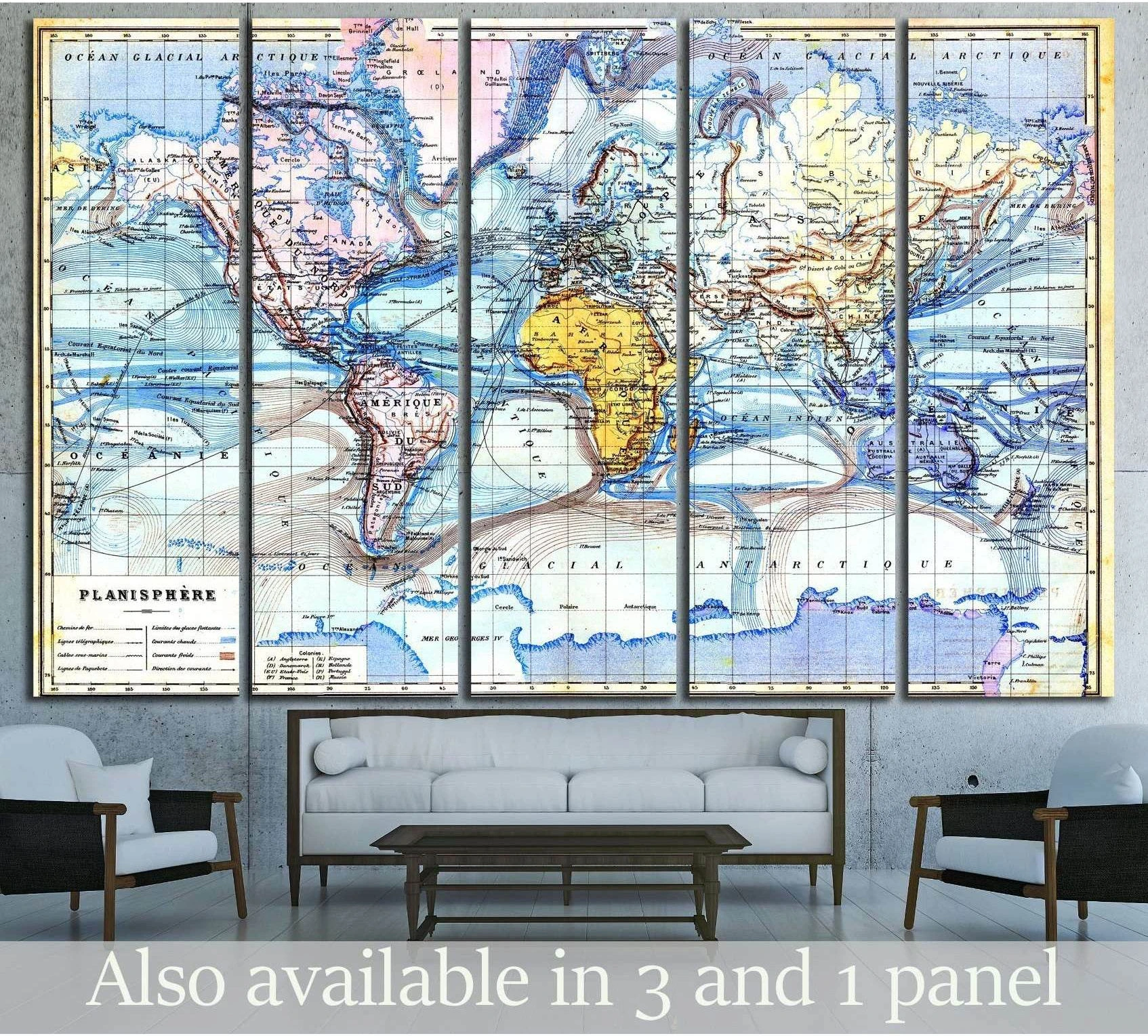 Vintage world map canvas print in six panels with antique atlas detail above a sofa in a modern living room