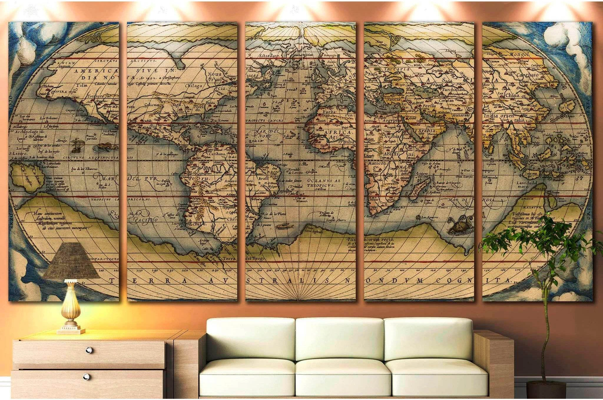 Vintage world map multi-panel canvas print above sofa in a warm neutral living room
