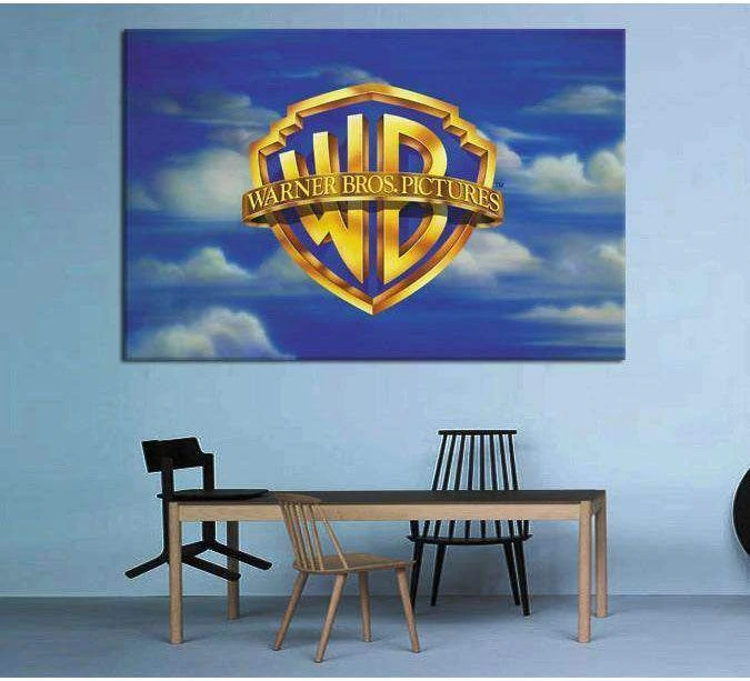 Warner Bros gold shield canvas print against blue sky clouds above a dining table