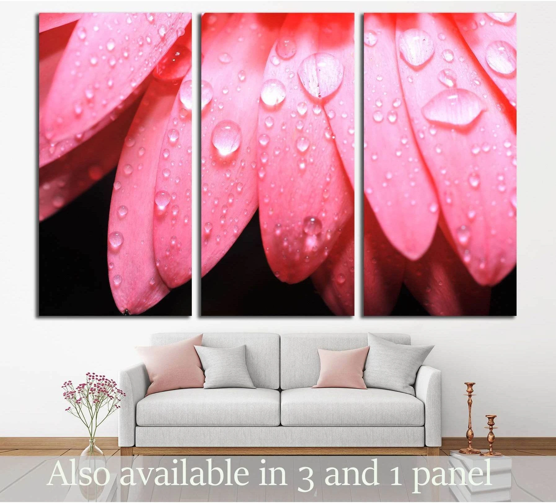 Pink flower petal canvas print with water droplets on a black background in a triptych living room mockup