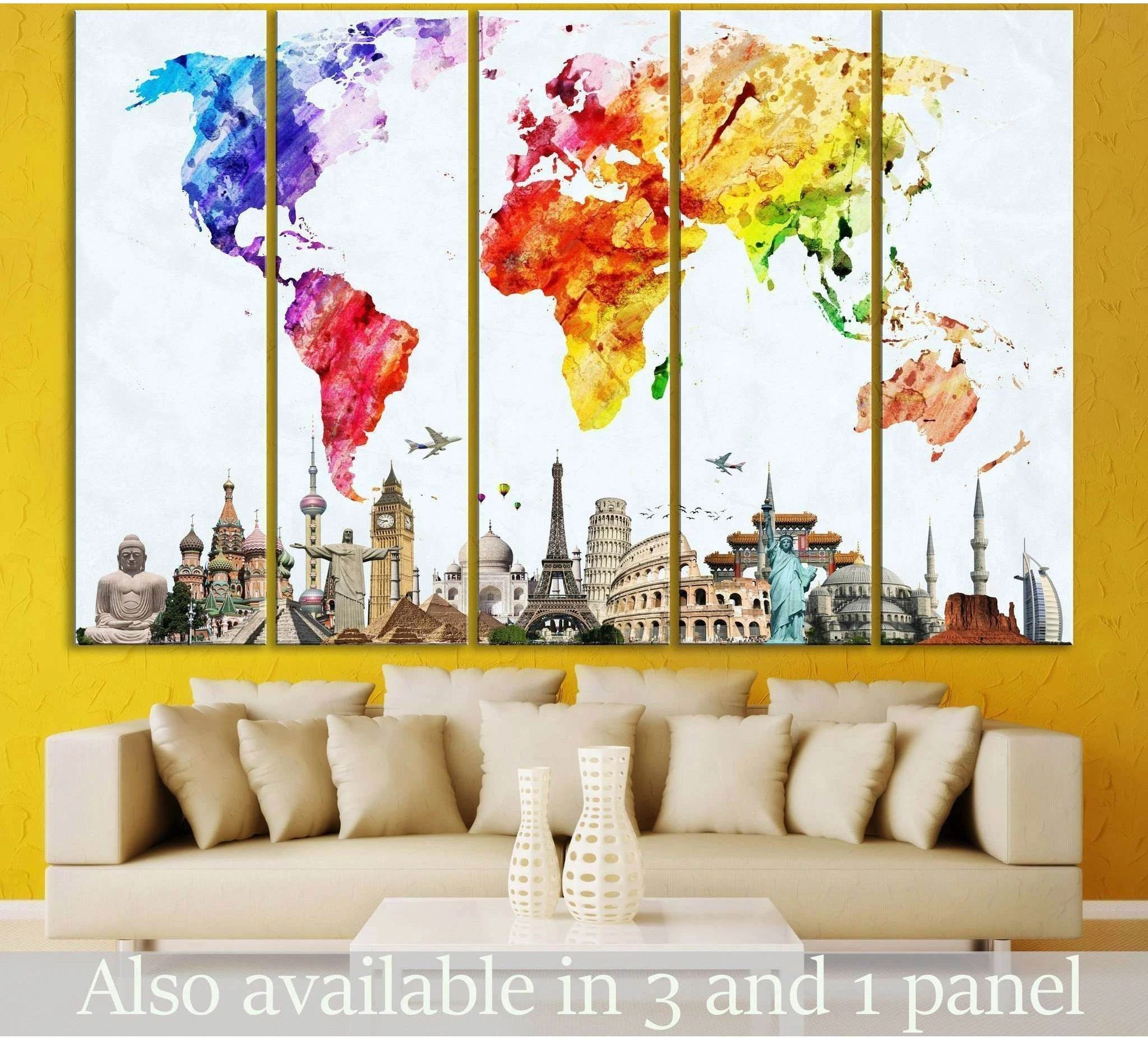 Watercolor world map canvas print with landmark skyline above sofa in a modern living room