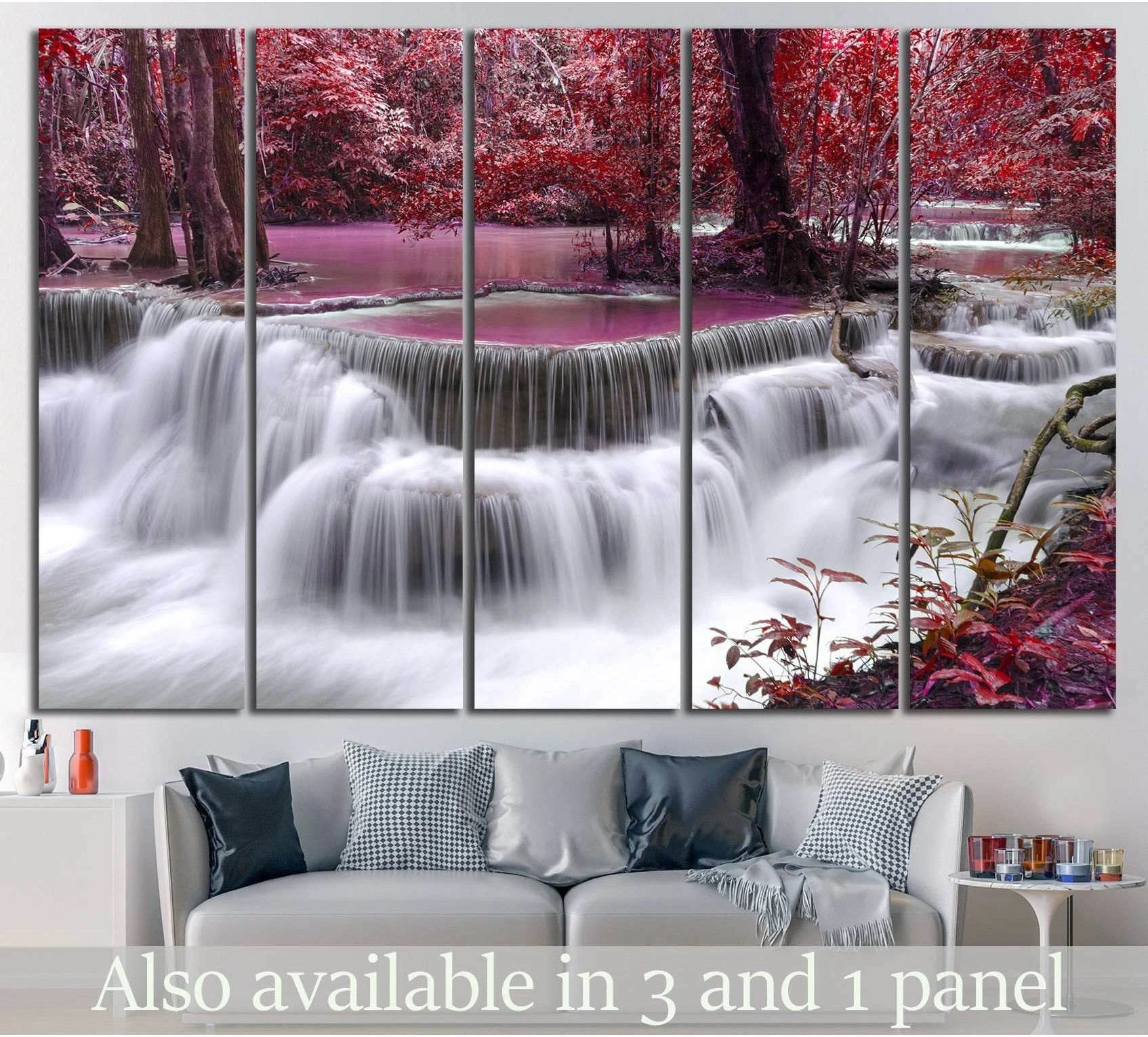 Thailand waterfall canvas print with pink foliage displayed above a sofa in a modern living room