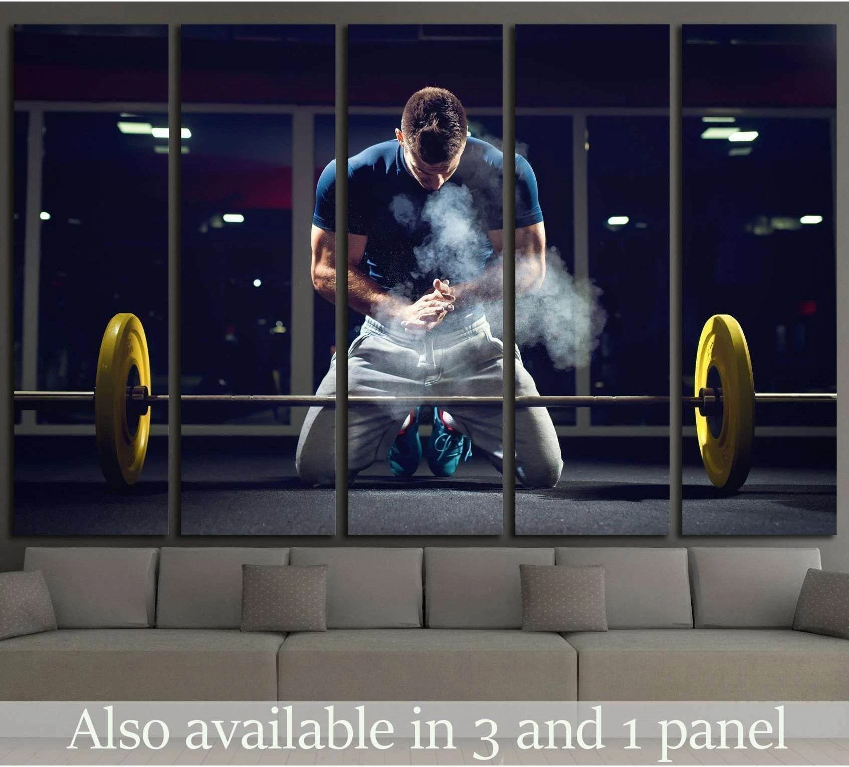 Weightlifter canvas print of athlete chalking hands beside barbell in a dark gym, displayed above sofa