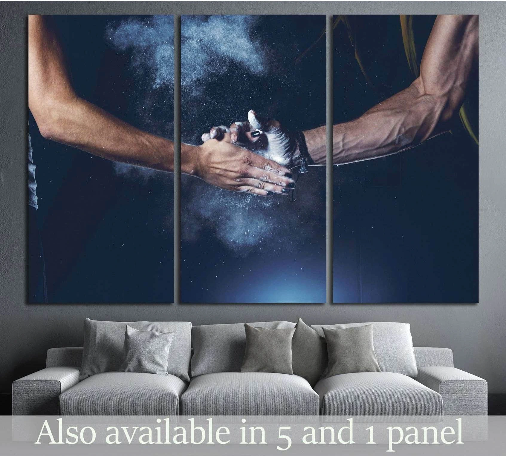 Triptych weightlifting canvas print with chalked hands above sofa in a modern living room