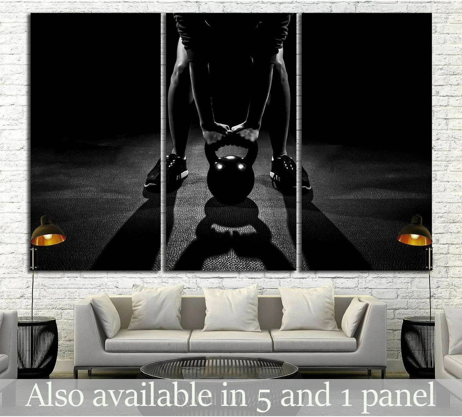 Black and white kettlebell canvas print with athlete in a dark gym, displayed above a sofa