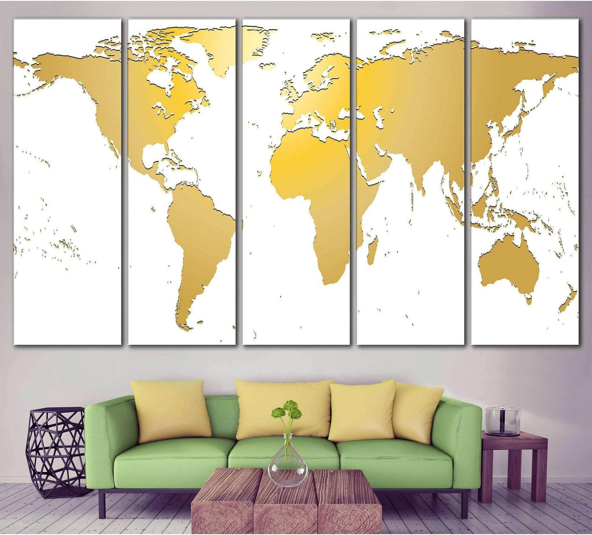 White and gold world map multi-panel canvas print displayed above a sofa in a modern living room