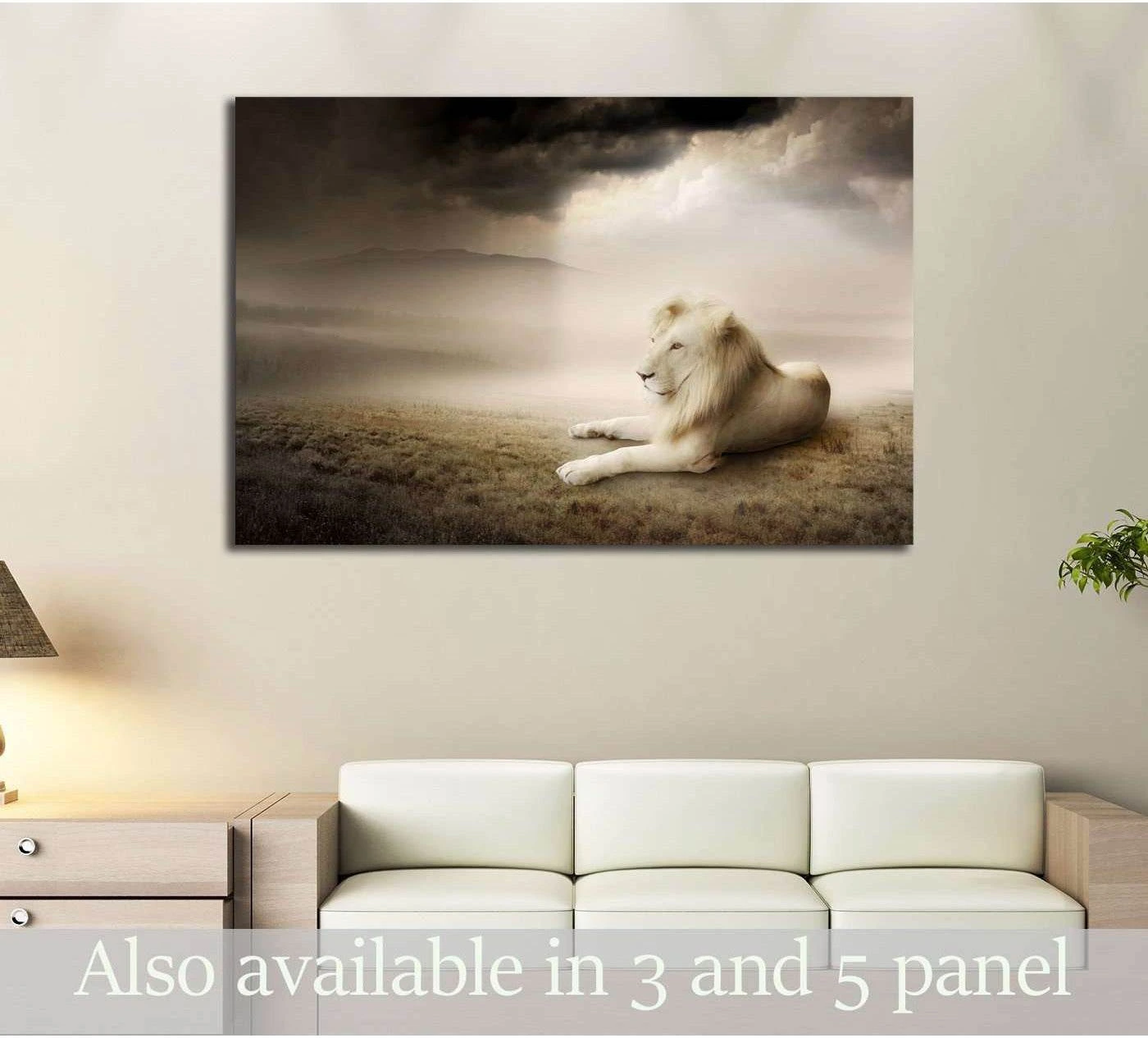 White lion canvas print resting at sunset in a misty sepia landscape, displayed above a sofa in a neutral living room