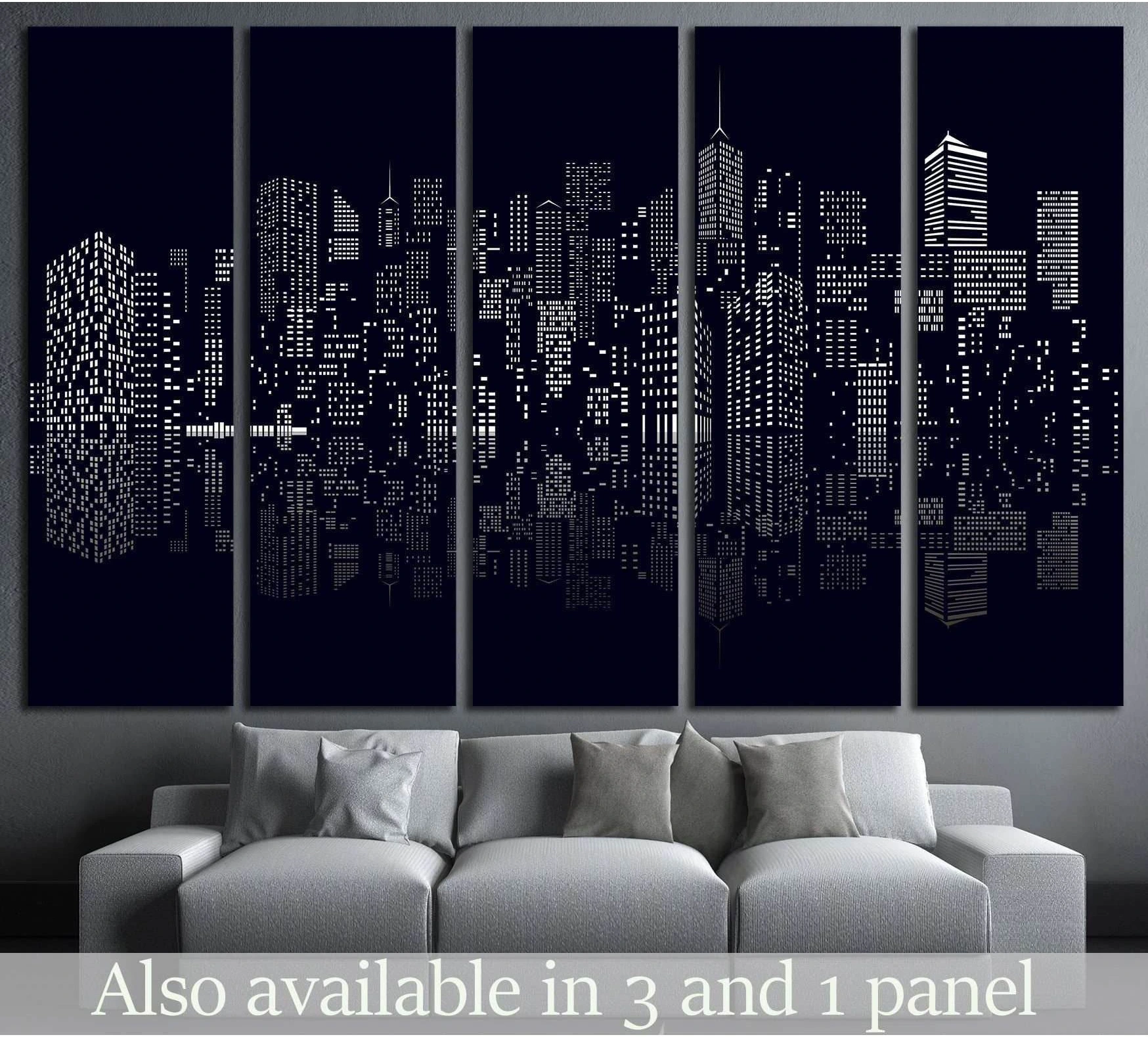 Black and white abstract city skyline canvas print hung above a gray sofa in a modern living room