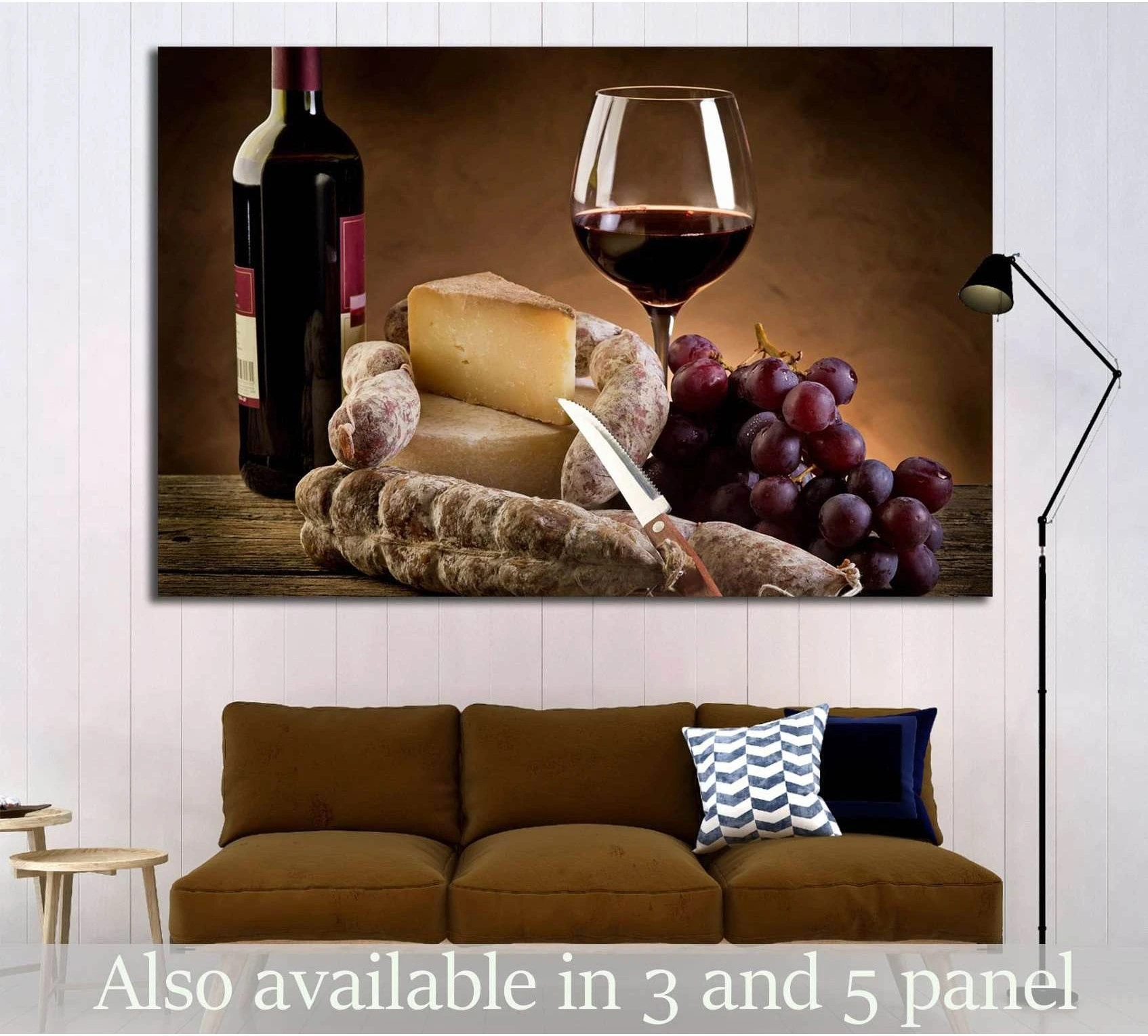 Wine and cheese canvas print with red grapes, salami, and glass of red wine above a sofa