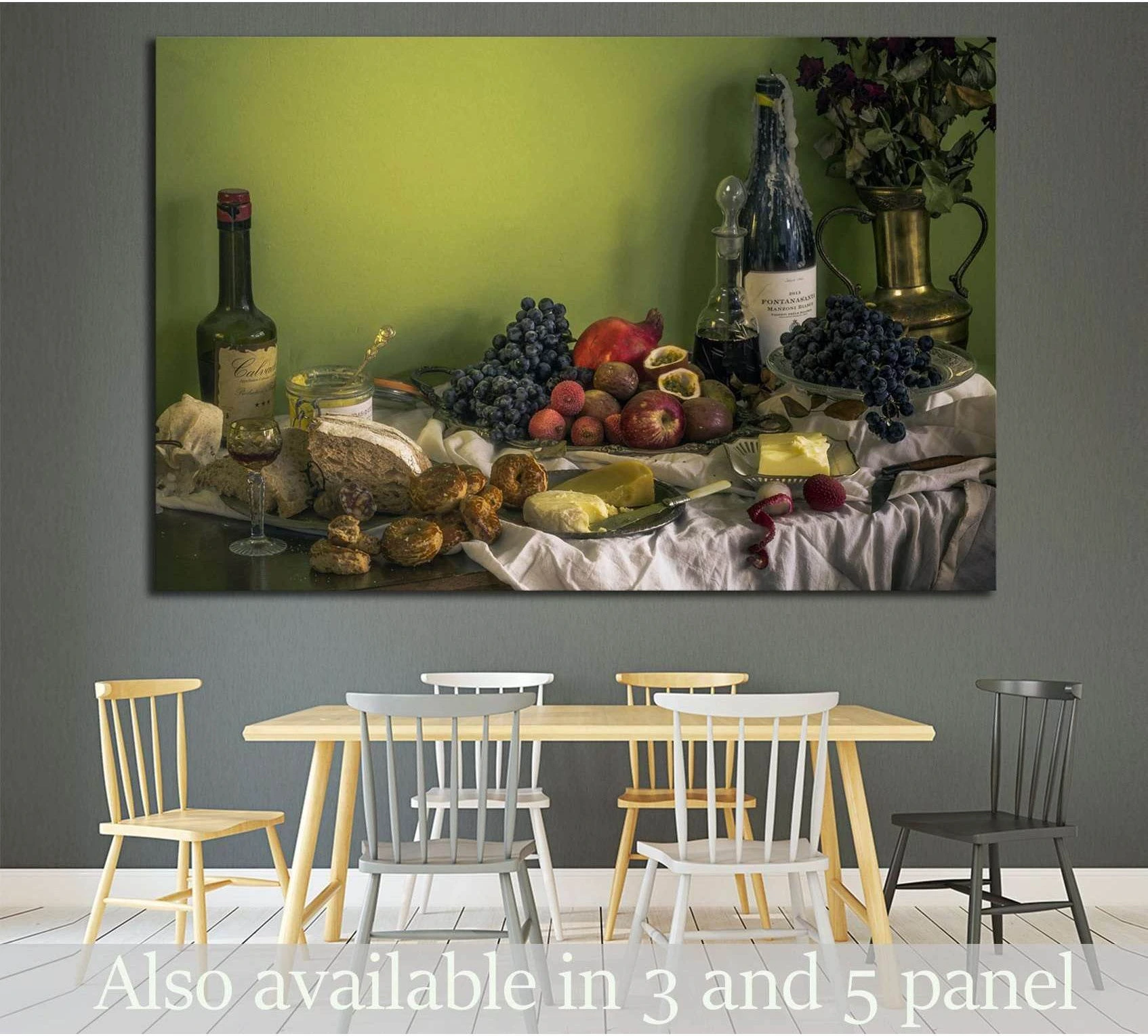 Still life wine canvas print with dark bottles, grapes, bread, and cheese above a dining table