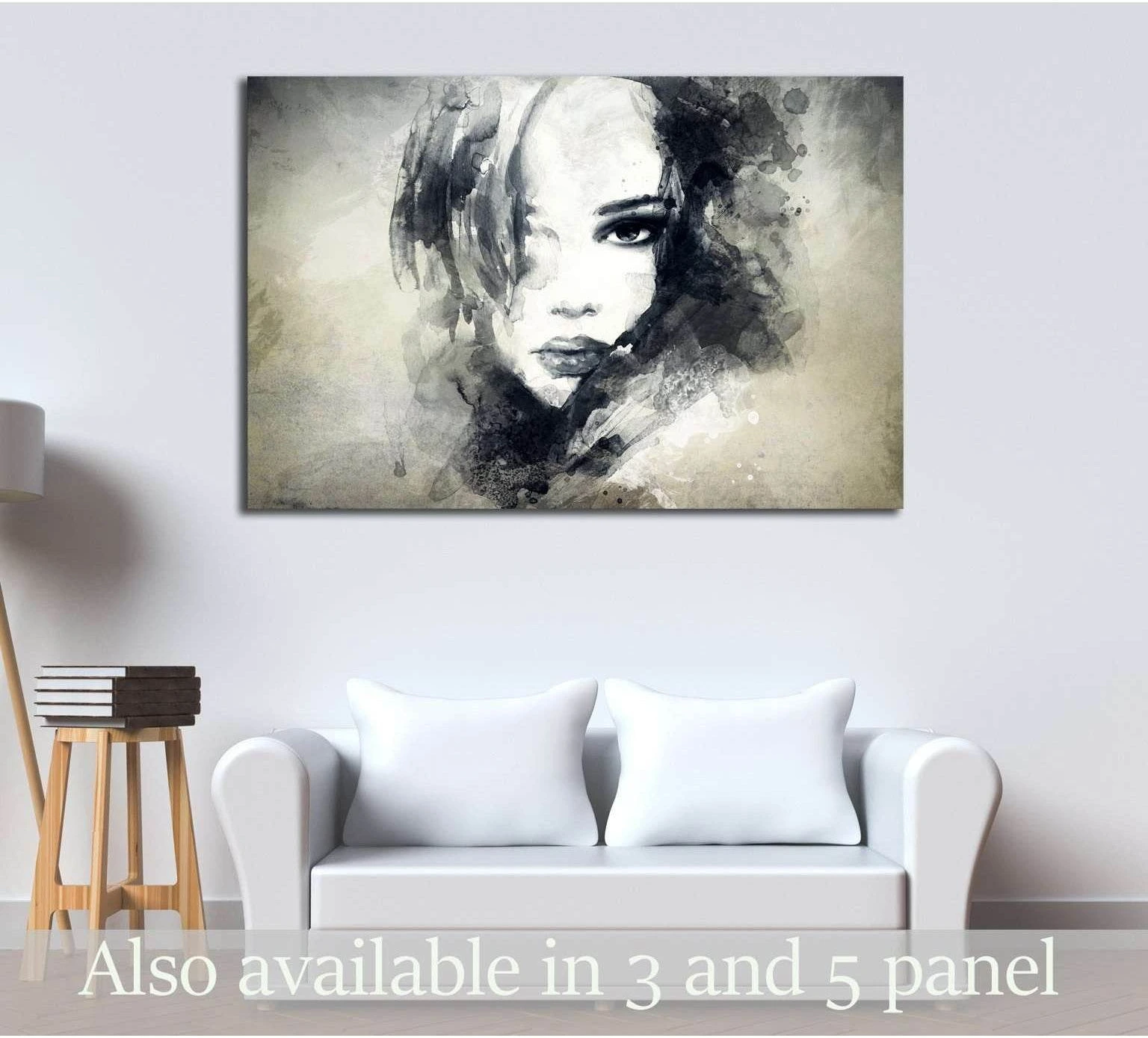 Monochrome watercolor woman face canvas print above sofa in a modern neutral living room