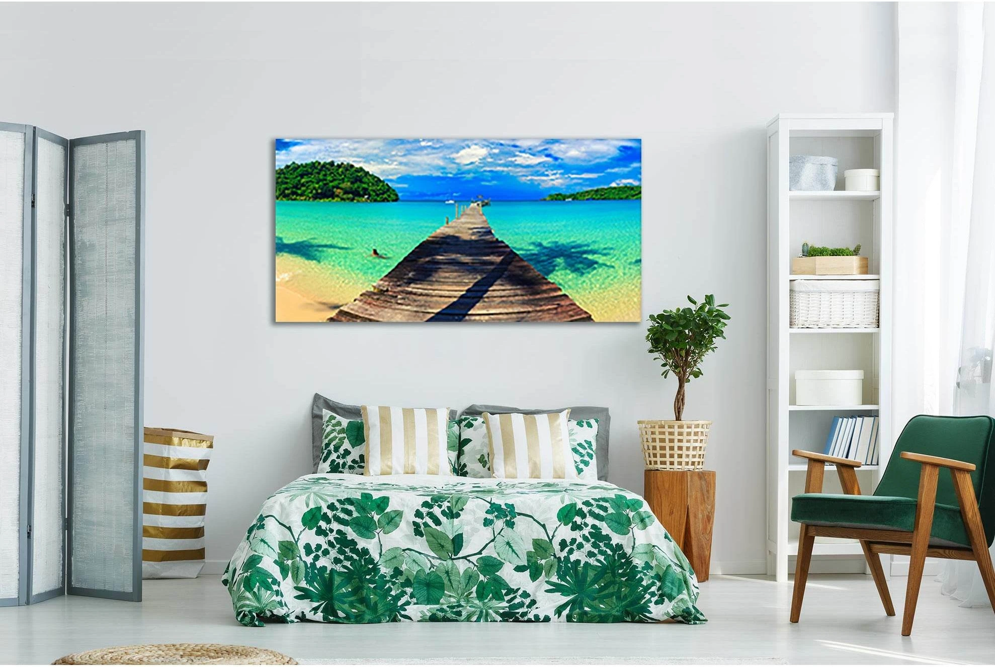 Tropical seascape with a wooden pier leading into turquoise water, green headlands and a blue cloudy sky detail view