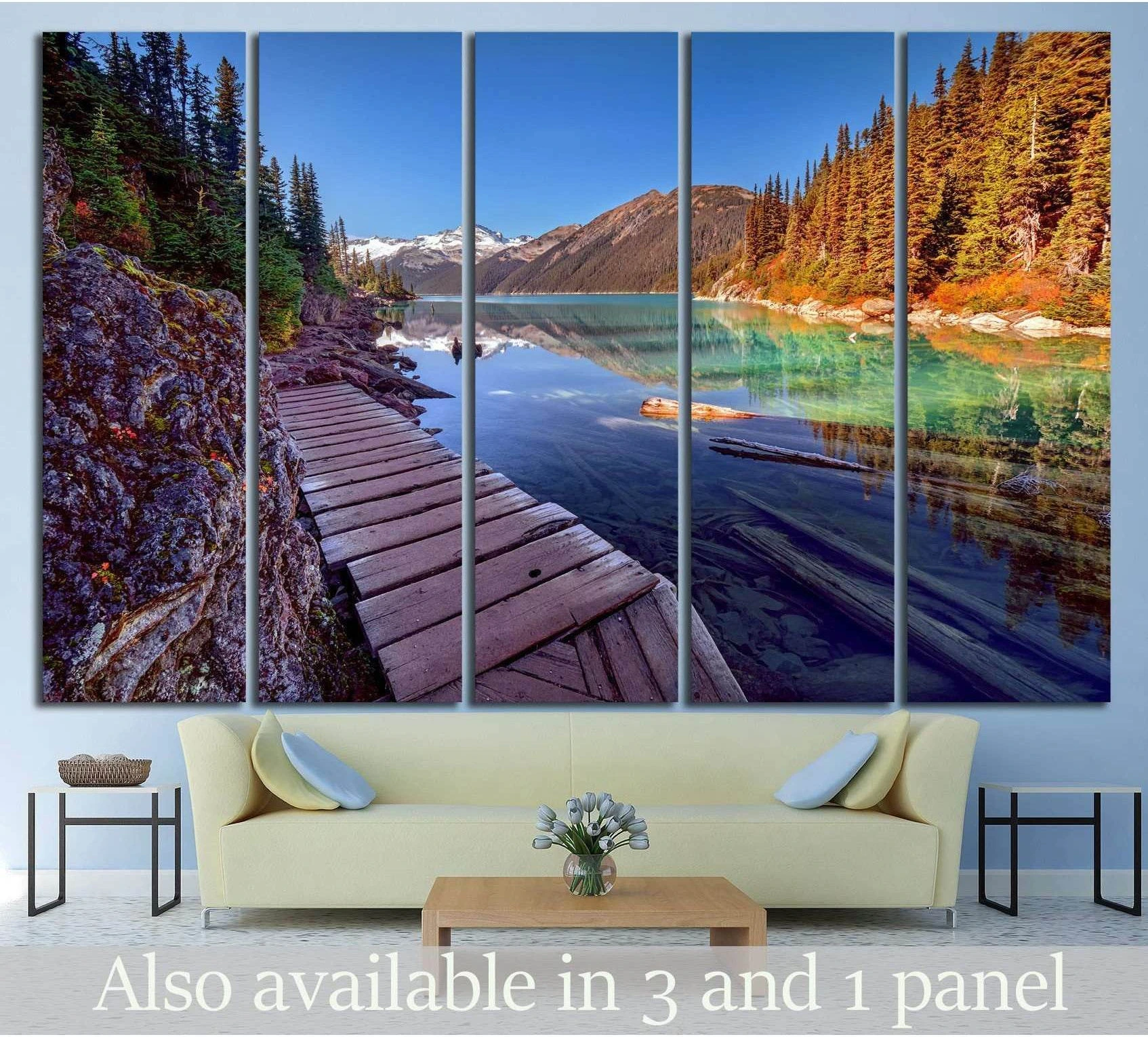 Mountain lake boardwalk canvas print above a sofa with turquoise water, pine forest, and alpine peaks