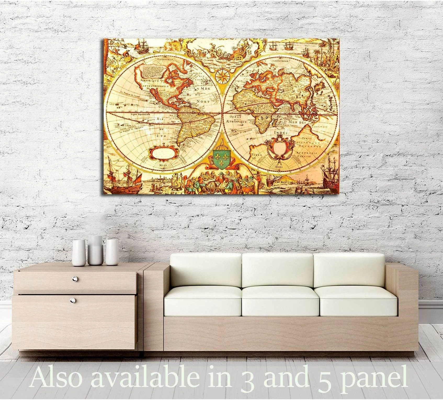 Antique world map canvas print with sepia cartography above a sofa in a minimalist room