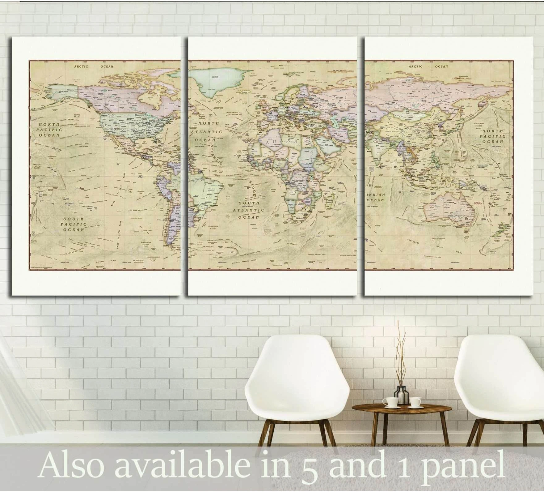 Vintage world map triptych canvas print in muted antique tones above chairs in a modern room