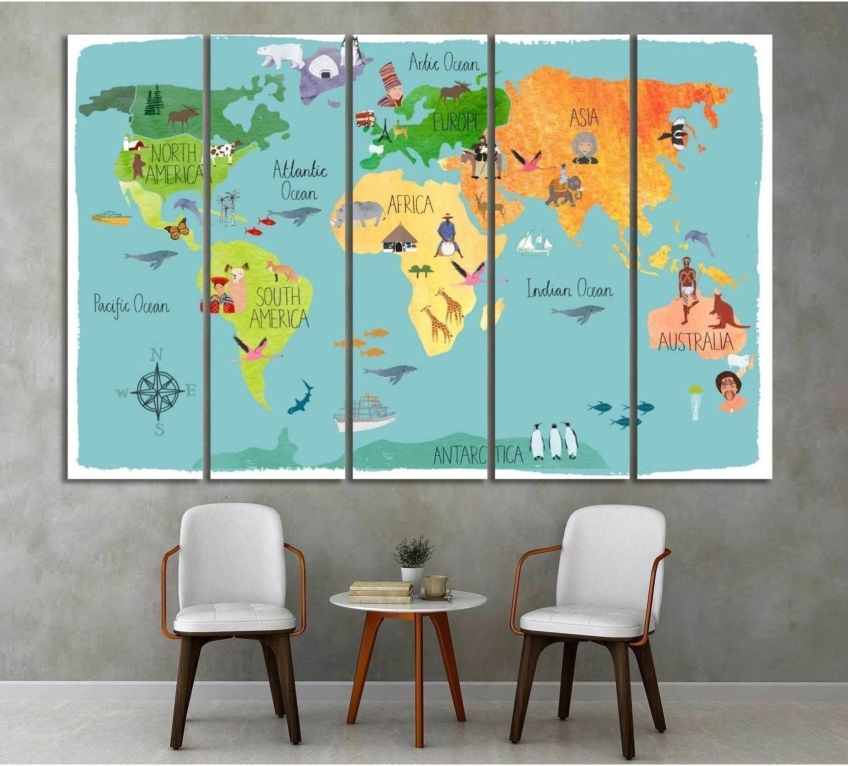 Colorful kids world map canvas print with animals and continents displayed above chairs