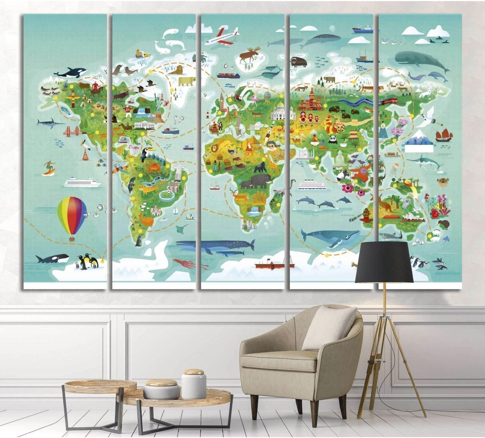 Kids world map canvas print with animals and landmarks hung in a nursery-style room