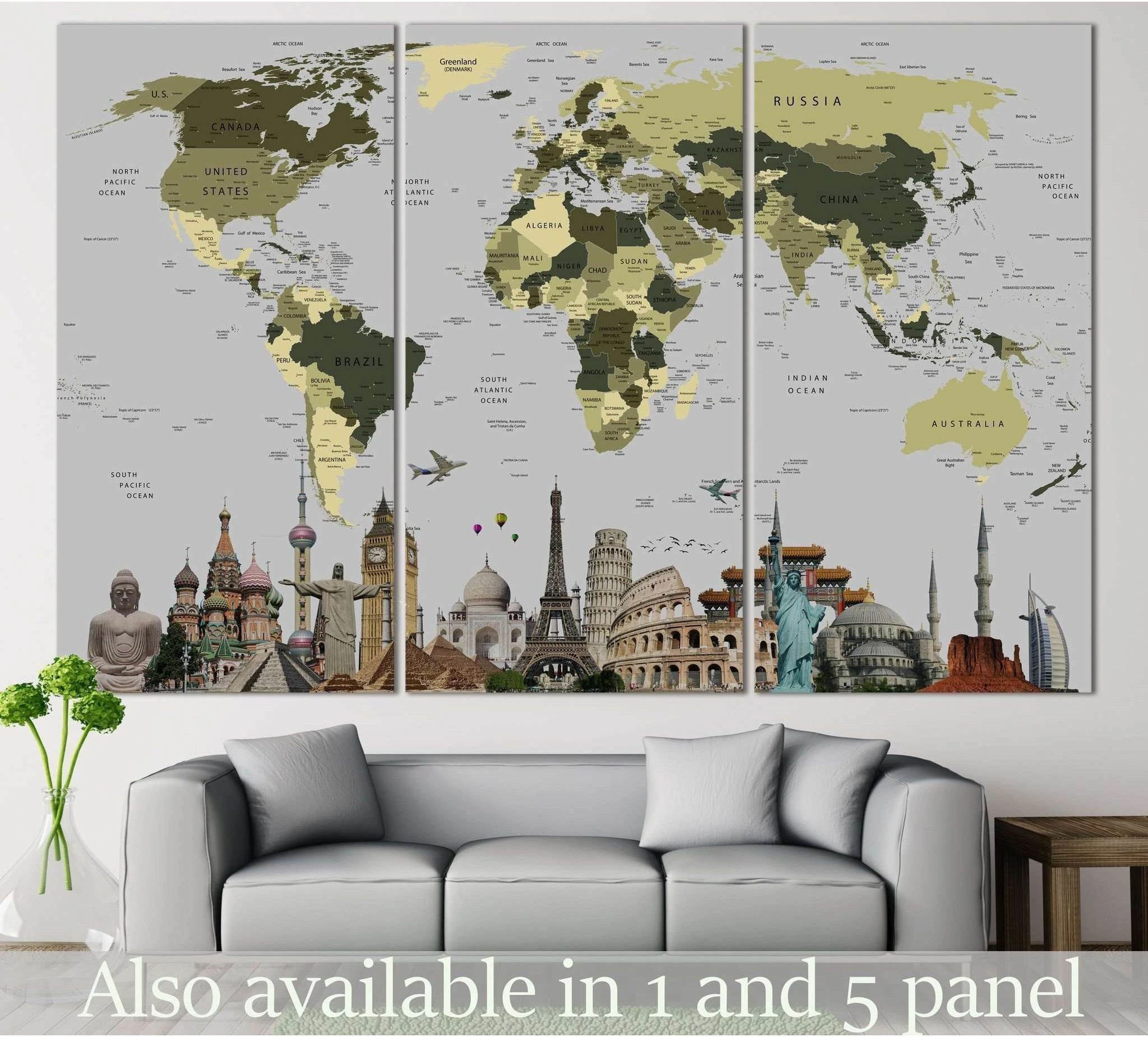 Triptych world map canvas print with famous landmarks in olive tones above a sofa in a modern living room