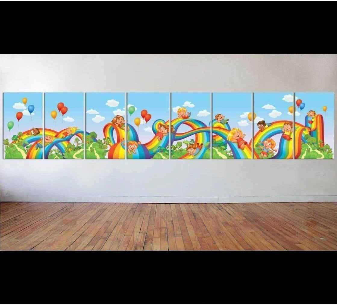 Children sliding down rainbow canvas print with balloons and blue sky in a nursery wall mockup