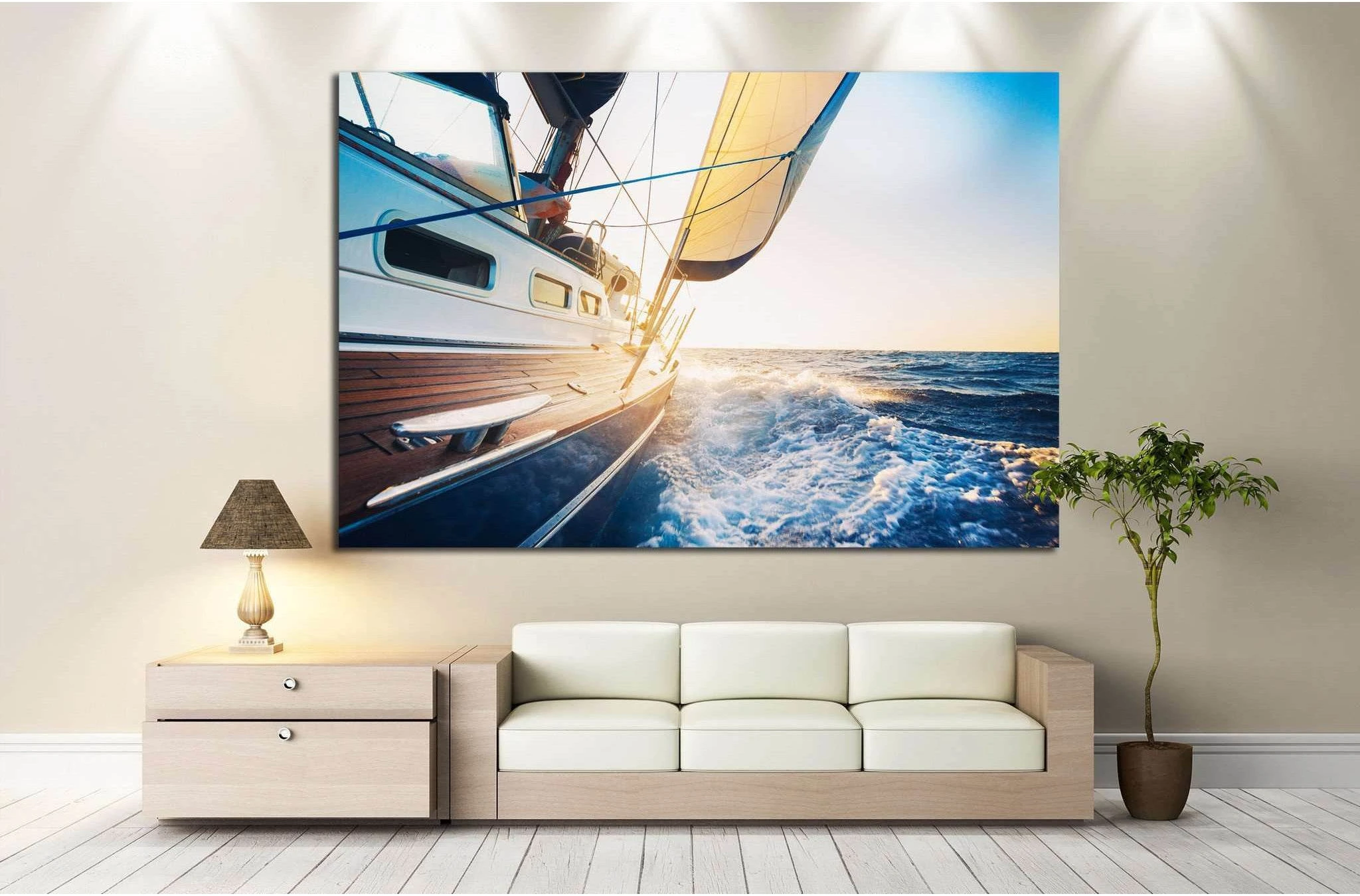 Sailboat canvas print of a yacht cutting through blue waves at sunset above a sofa in a modern living room