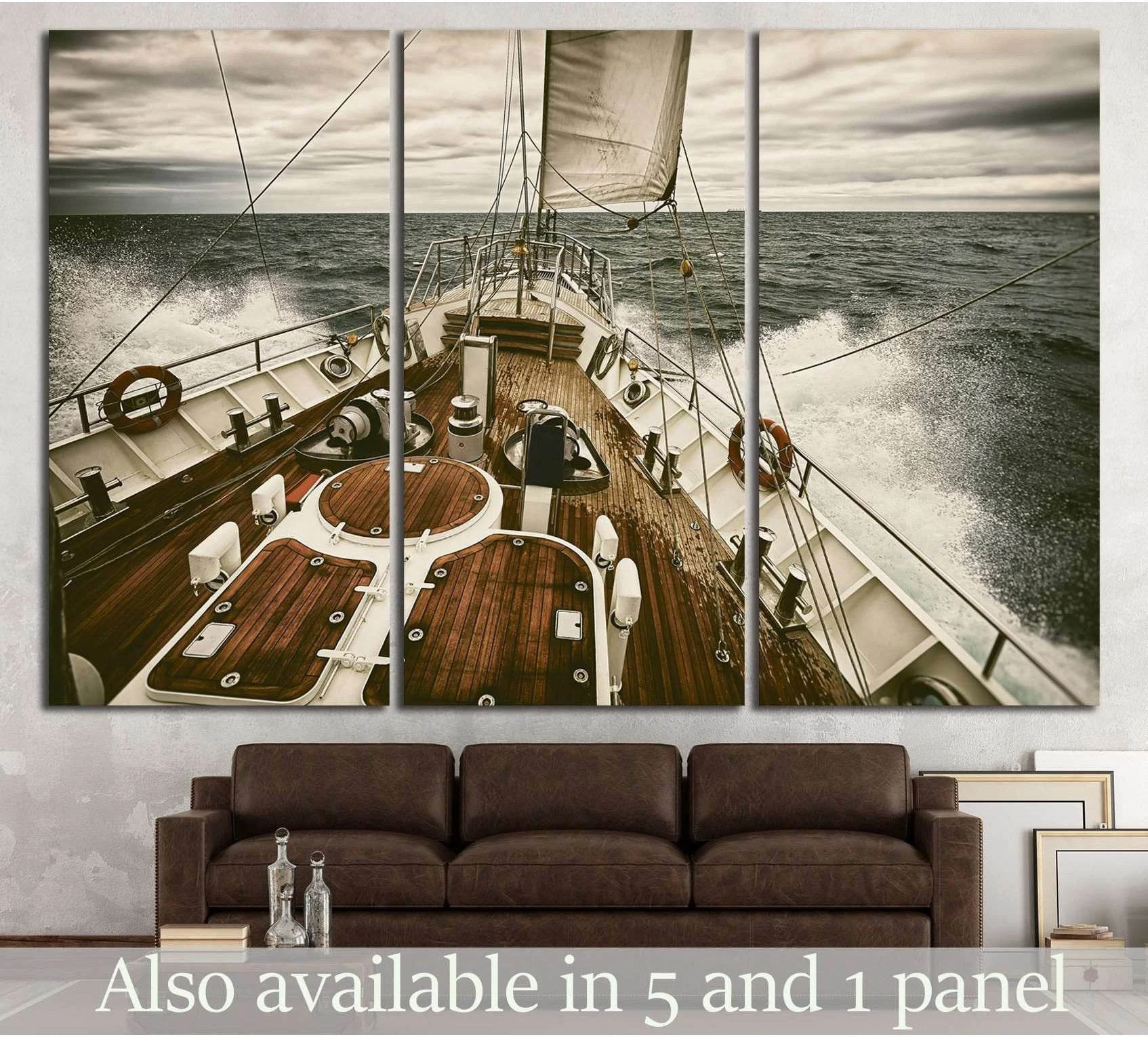 Yacht canvas print showing teak deck, white sails, and ocean spray above a sofa