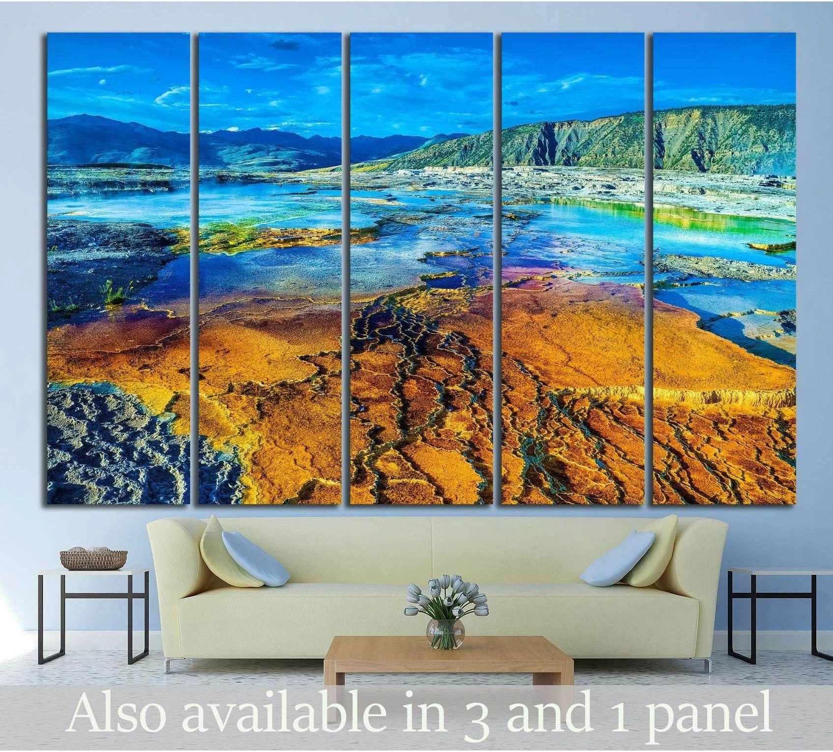 Yellowstone geothermal landscape canvas print with orange mineral pools and blue mountains above a sofa